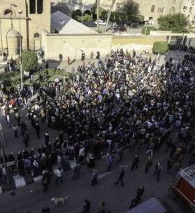 Hundreds gather outside Coptic Orthodox cathedral after explosion