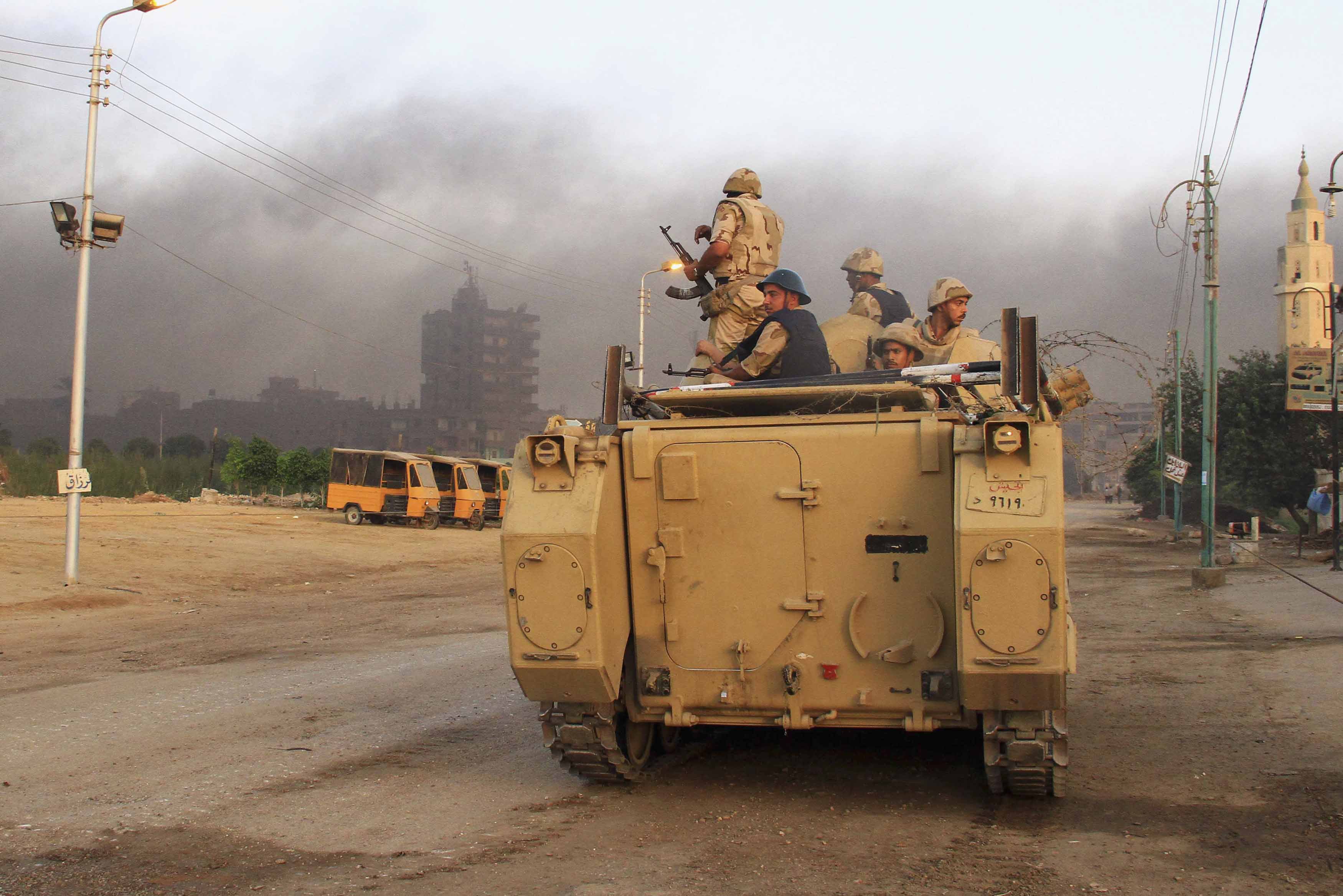Security forces hunt militants after storming town near Cairo