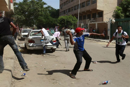 Pro-Mursi protesters set fire to church, two armored vehicles in Suez