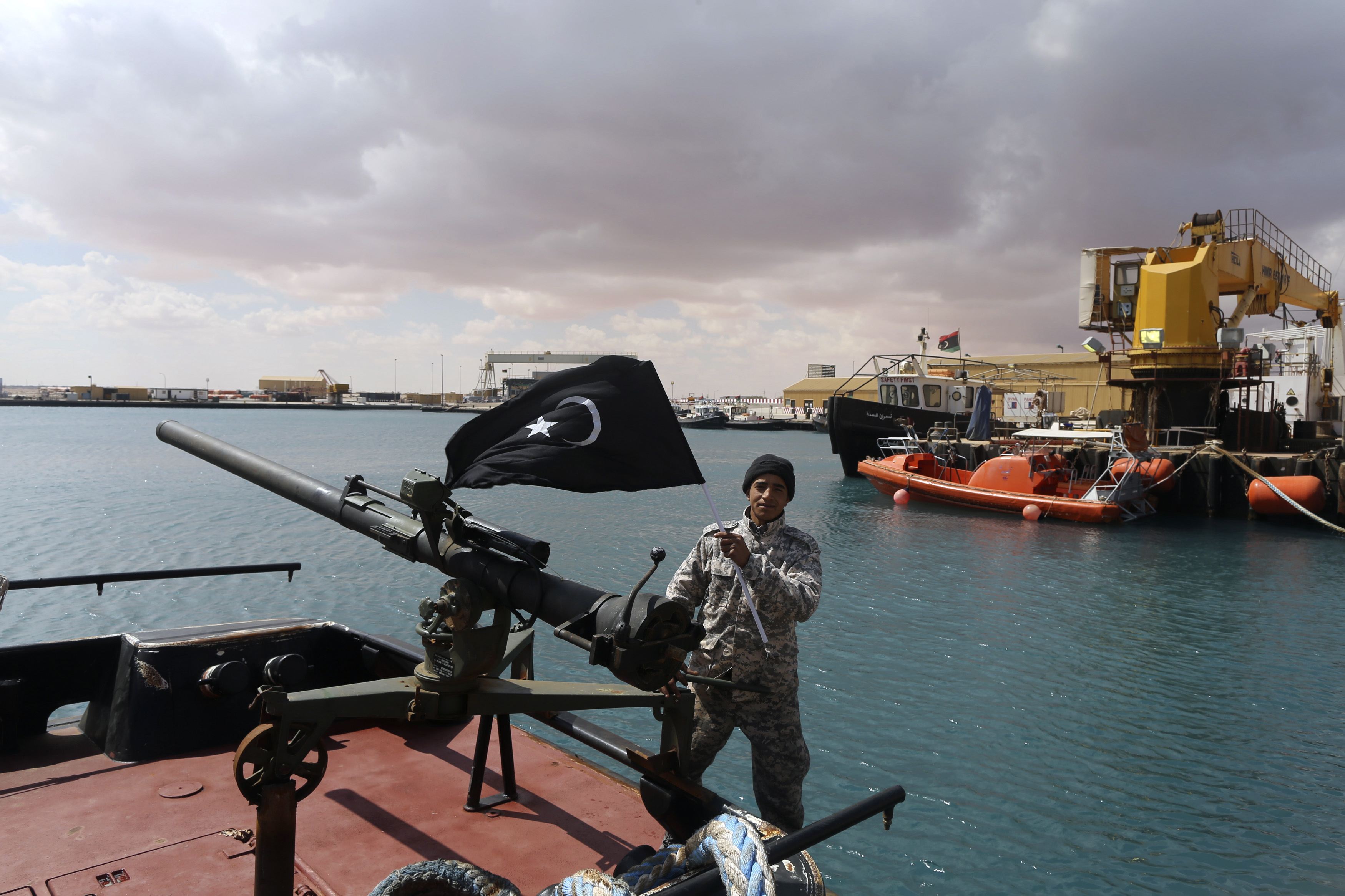 Heavy fighting near seaport of Libyan city Benghazi, navy ship hit