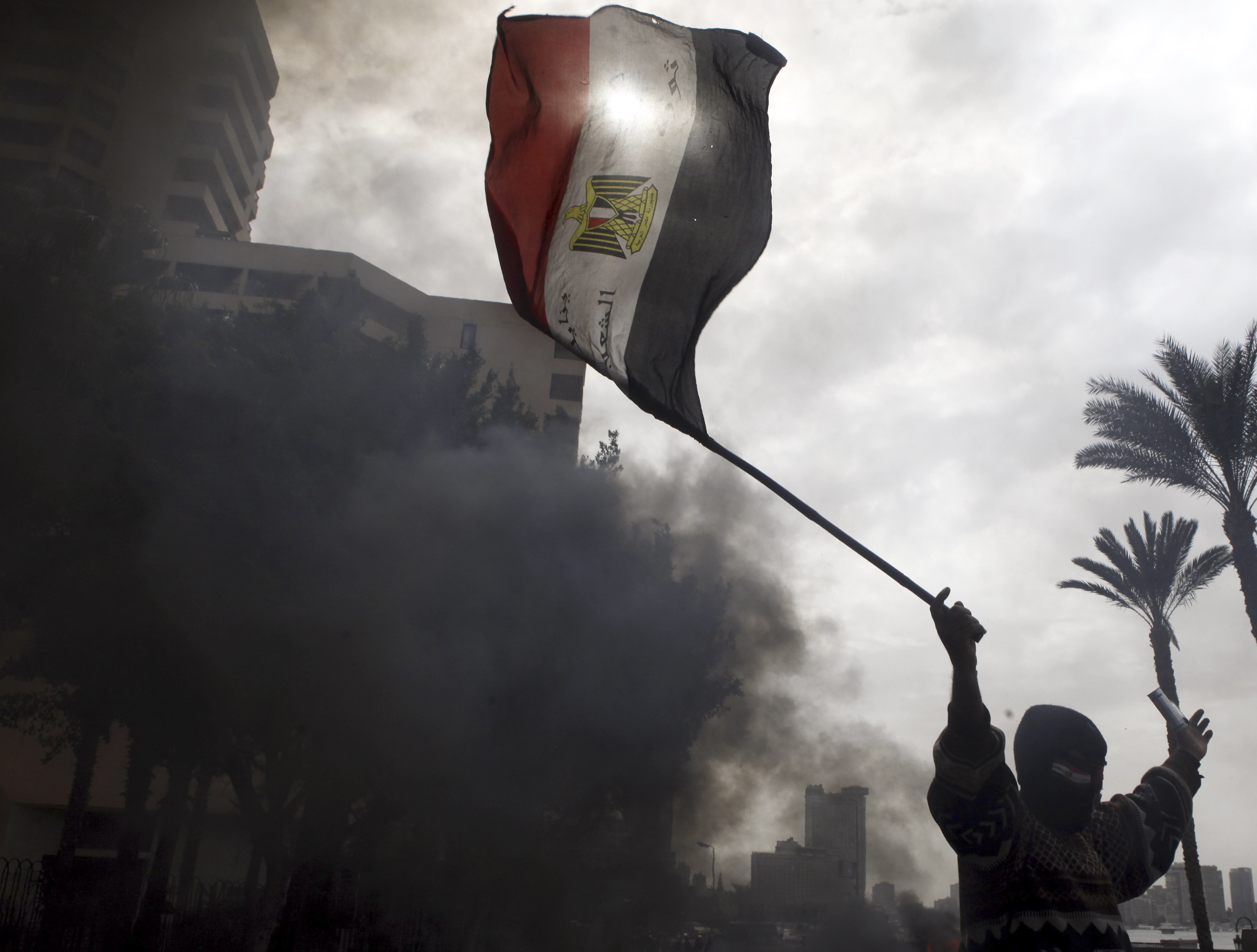 Egypt court acquits 7 policemen of killing protesters