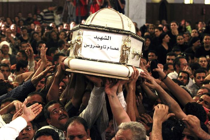 Egypt court sentences four men to hang for killing priest