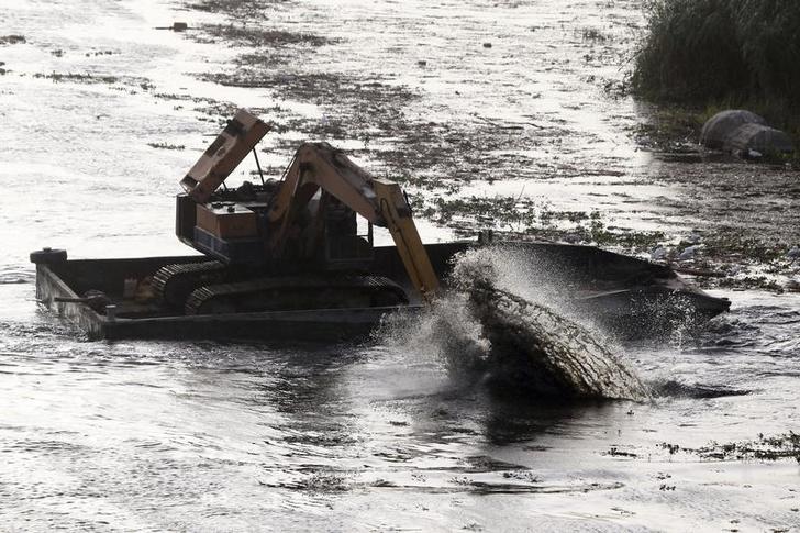 A barge capsized in Egypt dropping tons of phosphate into Nile river