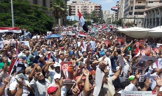 Rival groups march in Alexandria, five Brotherhood supporters arrested